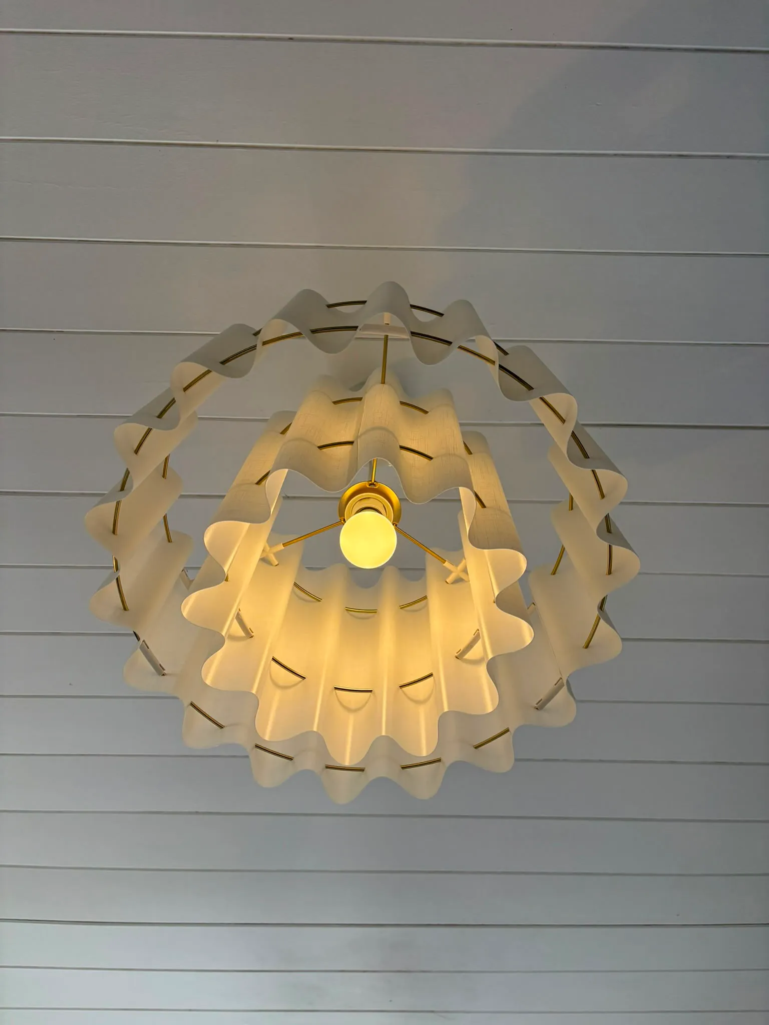 Tiered pendant light photographed from directly below showing concentric rings